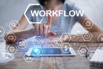 woman-using-tablet-pc-pressing-on-virtual-screen-and-selecting-workflow