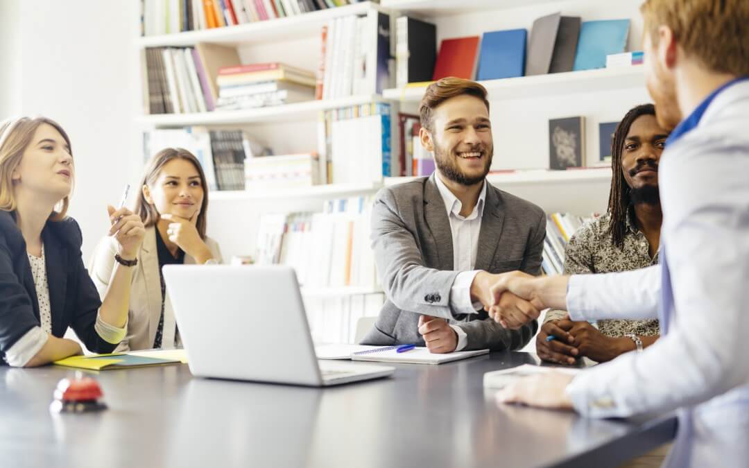 a businessman shaking hands with a client