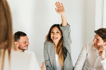 woman raising her hand