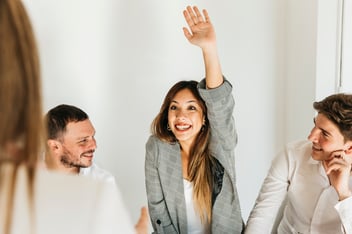 woman raising her hand