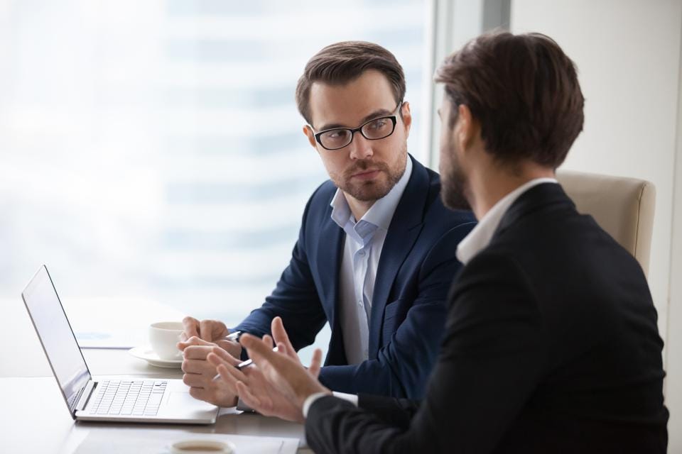two men having a discussion