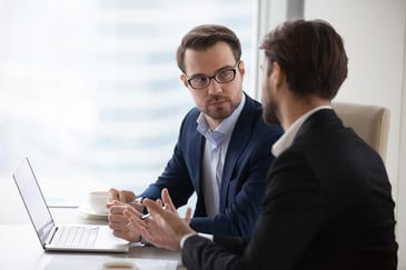 two men having a discussion