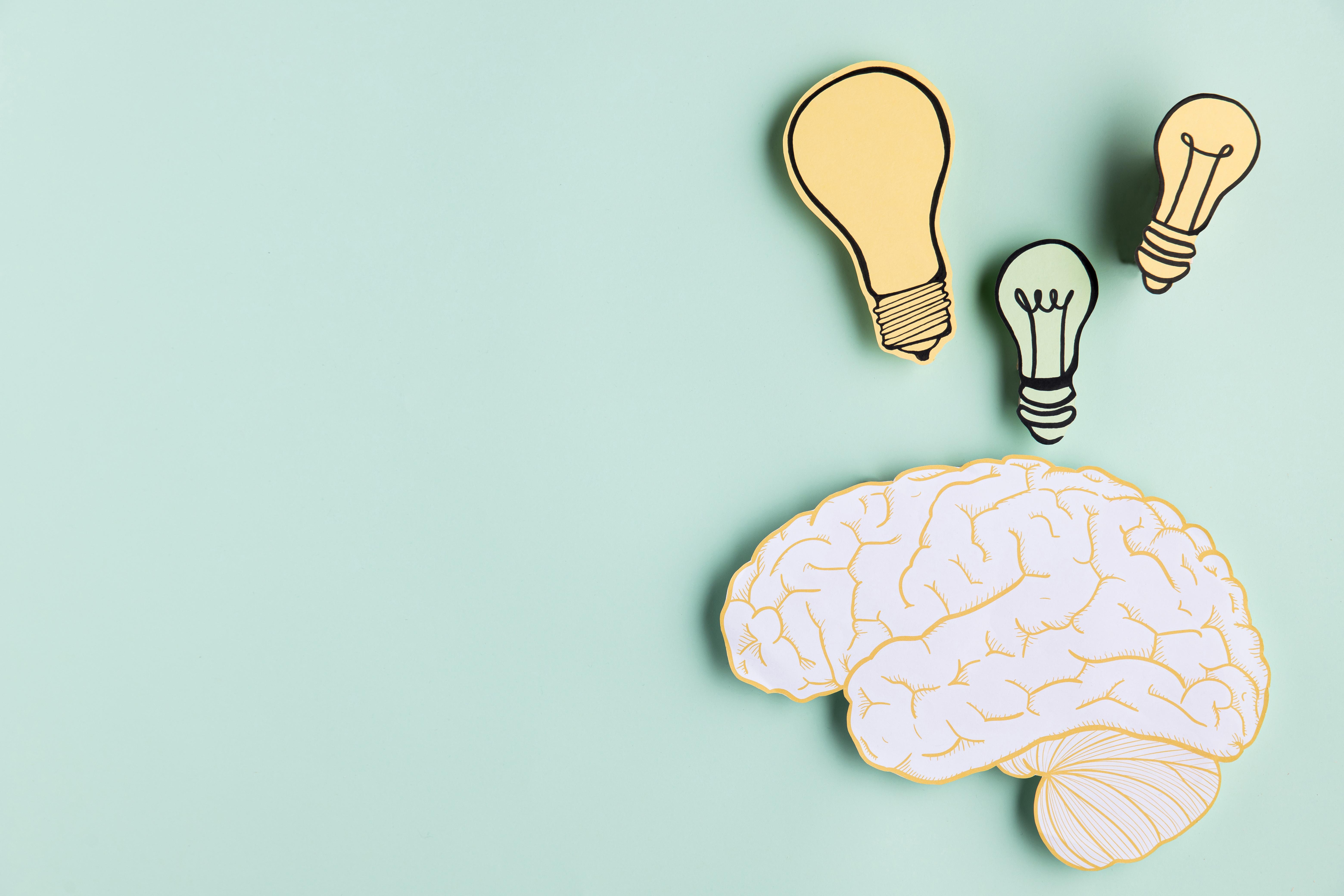 paper brain with light bulbs