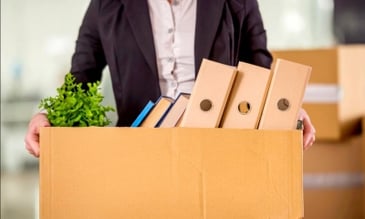a man holding a box of this office stuff - fired