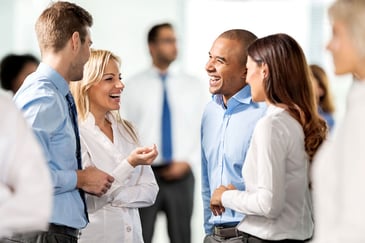 man having a good conversation with a group of people