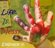 childs hand with paint