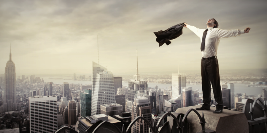 man on top of a highrise building