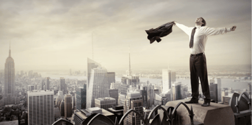 man on top of a highrise building