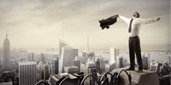 man on top of a highrise building
