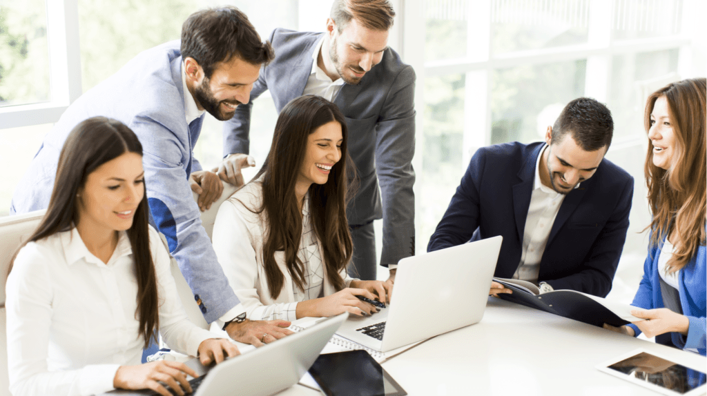 a group of smiling professionals in a meeting