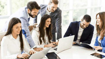 a group of smiling professionals in a meeting